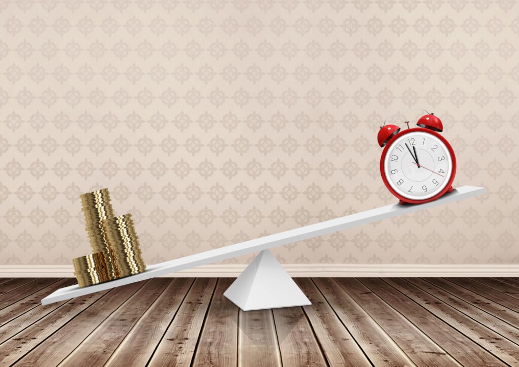 Digital composition of alarm clock and stack of coins balancing on seesaw against patterned wall