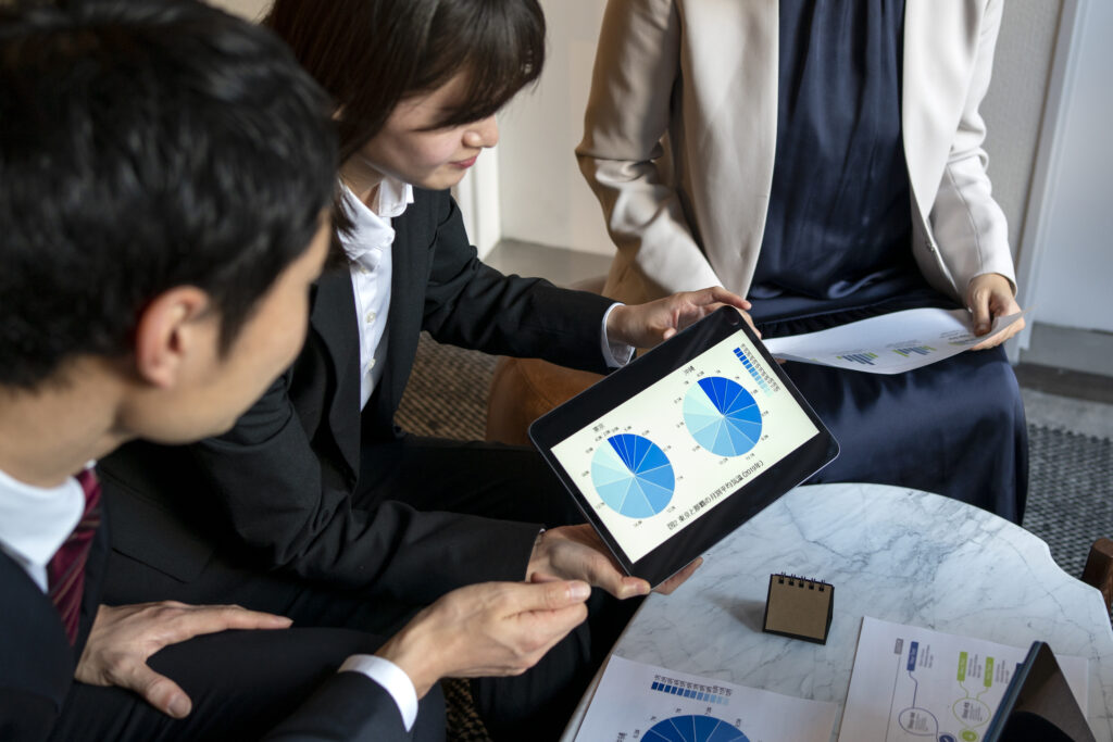 business-people-working-with-ipad-side-view outsourcing lead generation