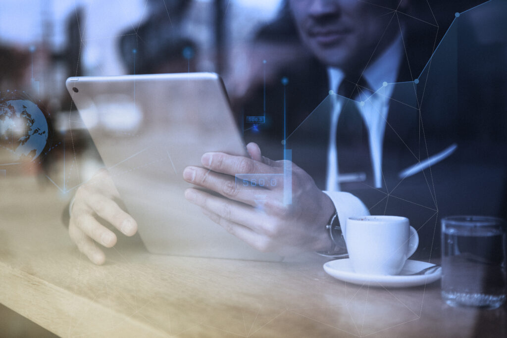 Businessman working on tablet in cafe technology