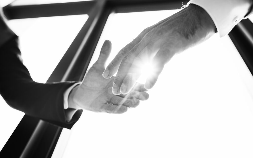 closeup-hands-shaking-partnership-meeting high standards with outsourced sales