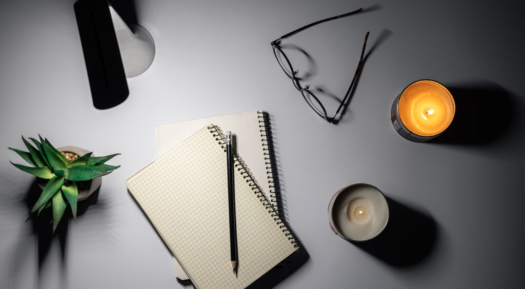 Flat lay, notepad and lamp, night workspace at home, deadline.