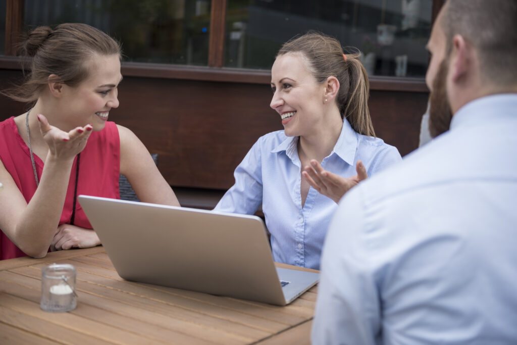 Friendly business discussion at cafe expert sales presentation